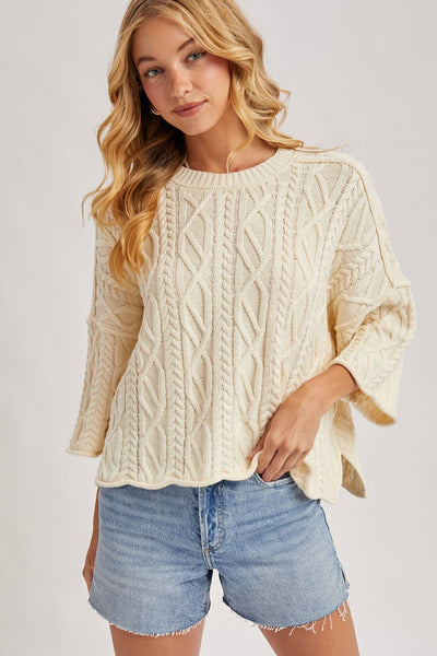 OVERSIZED BELL SLEEVE CABLE KNIT SWEATER
