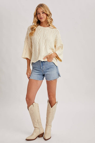 OVERSIZED BELL SLEEVE CABLE KNIT SWEATER