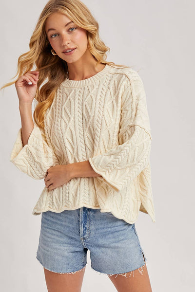 OVERSIZED BELL SLEEVE CABLE KNIT SWEATER